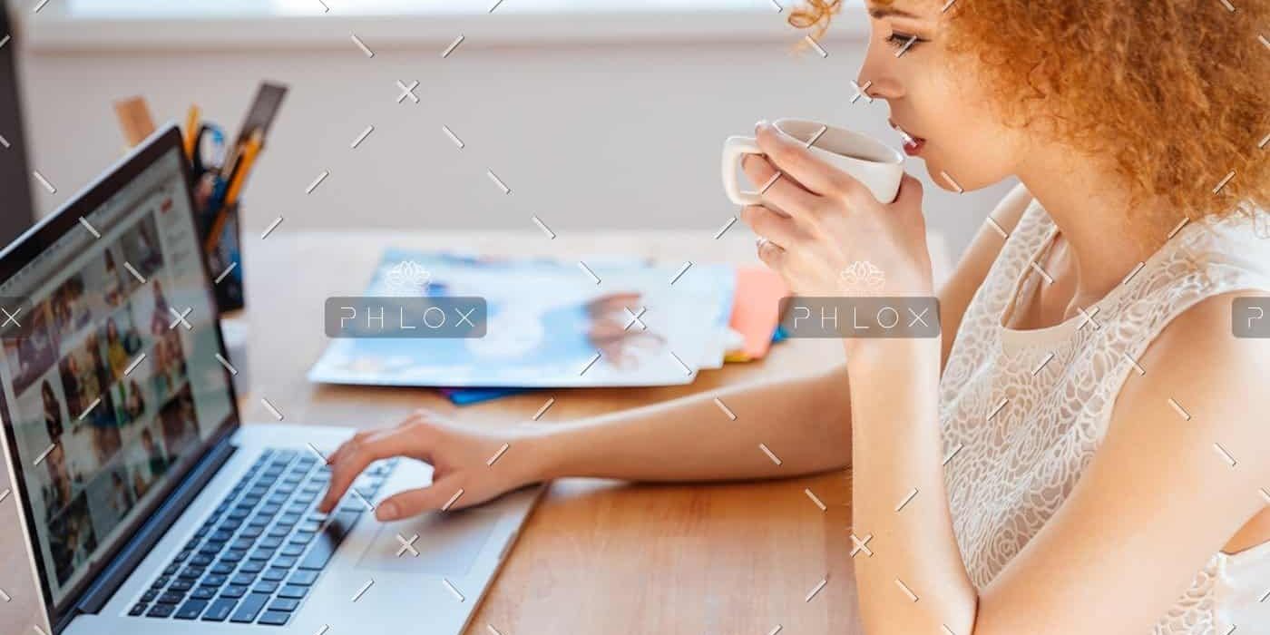 demo-attachment-218-woman-photographer-drinking-coffee-and-working-PJNBP6U@2x